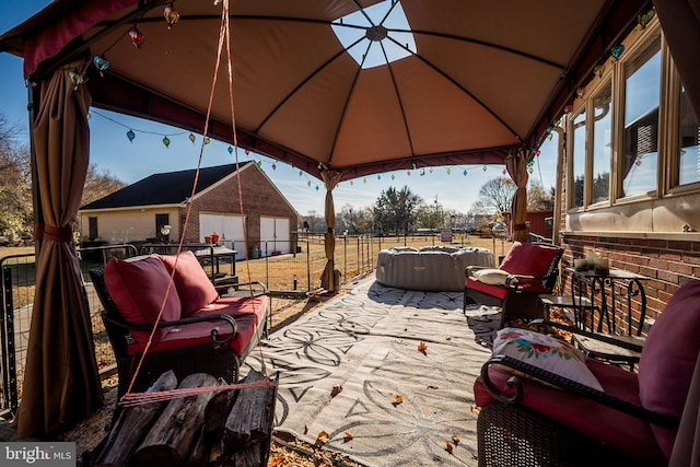 view of patio / terrace featuring a gazebo and an outdoor structure