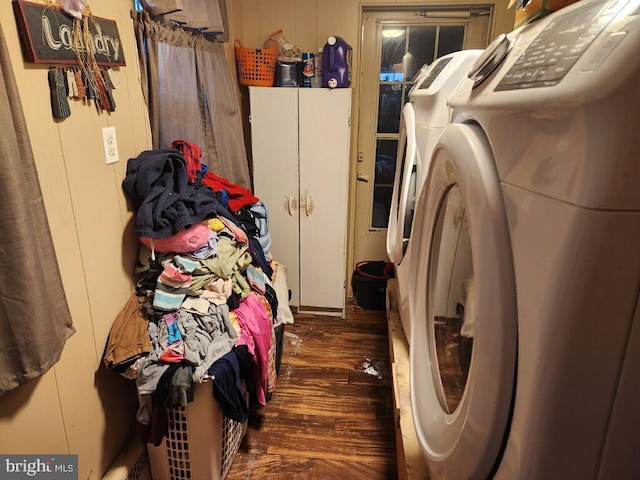 clothes washing area featuring cabinets and independent washer and dryer