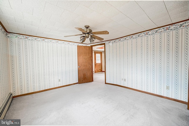 unfurnished bedroom featuring baseboard heating, ceiling fan, and carpet floors