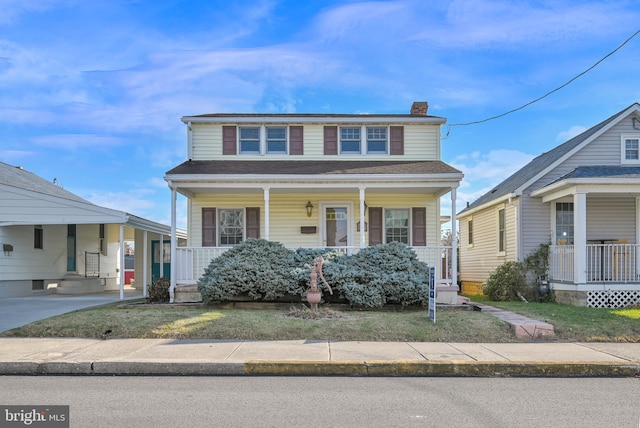 view of front of house featuring covered porch and a carport