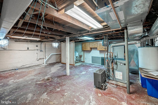 basement featuring water heater and sink