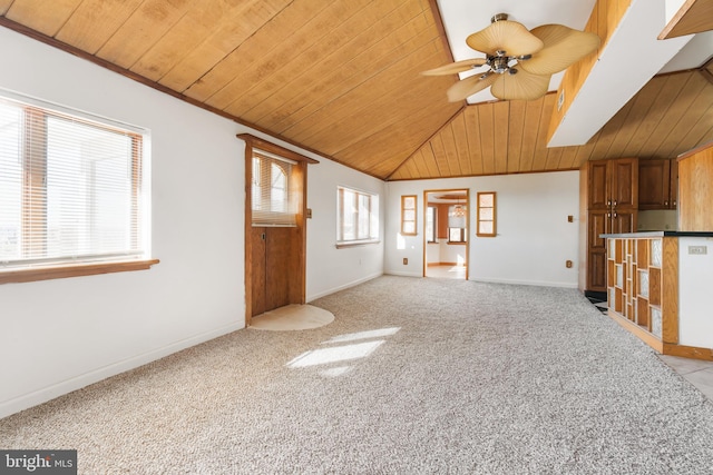 unfurnished living room with a ceiling fan, lofted ceiling, wooden ceiling, and light carpet