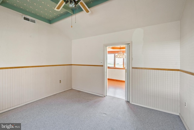 unfurnished room featuring vaulted ceiling and ceiling fan