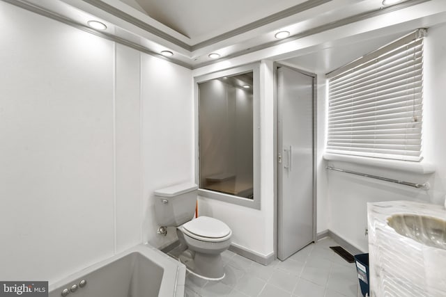 bathroom with a tub, tile patterned flooring, vanity, and toilet