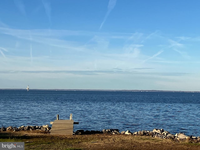 property view of water with a dock