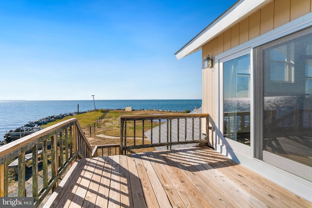 wooden terrace with a water view