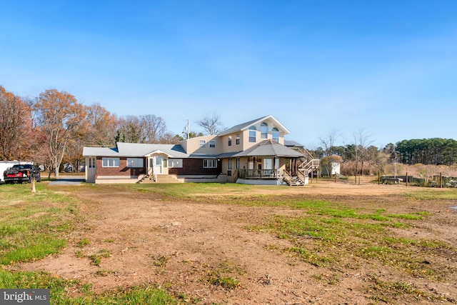 view of front of house featuring driveway and a gazebo