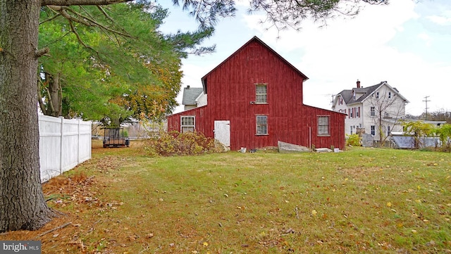 view of property exterior with a lawn