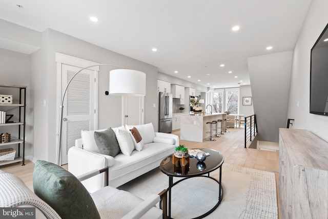 living room with light hardwood / wood-style flooring