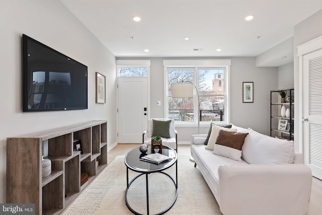 living room with light hardwood / wood-style floors