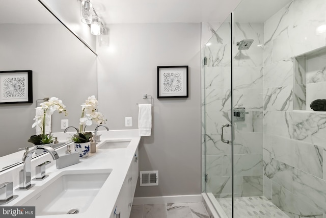 bathroom with vanity and an enclosed shower