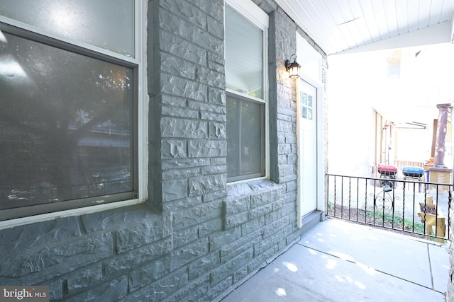 view of side of home featuring a porch