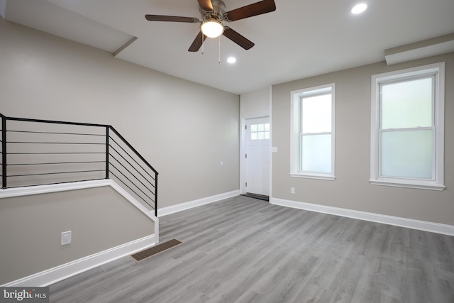 entryway with ceiling fan and light hardwood / wood-style flooring