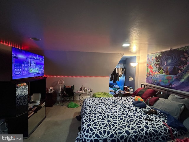 carpeted bedroom featuring lofted ceiling