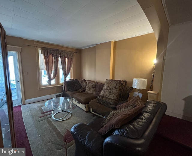 living room with carpet floors and ornamental molding