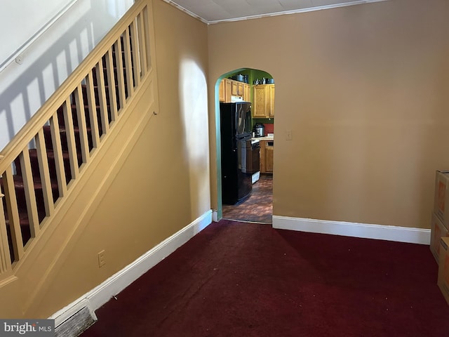 stairs with carpet flooring and ornamental molding