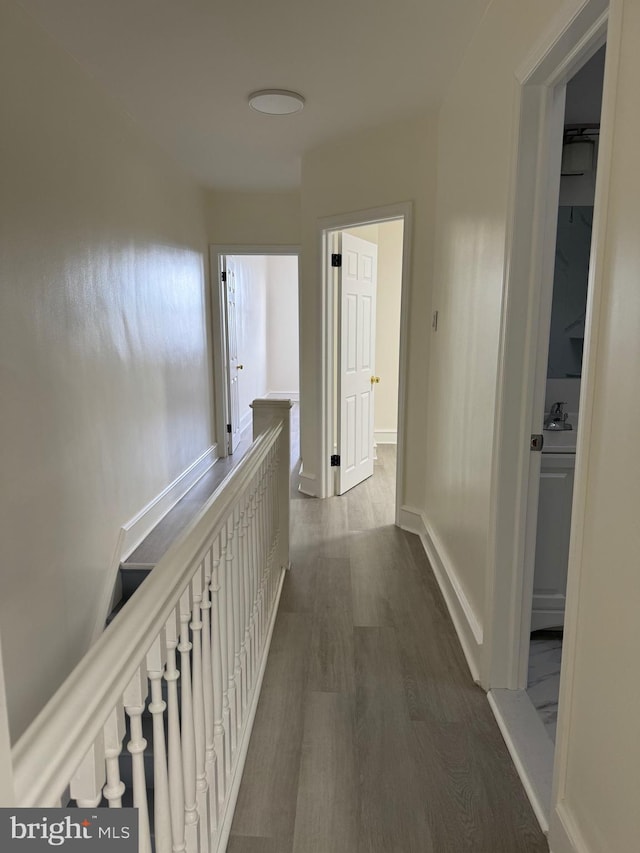 hall with dark hardwood / wood-style flooring