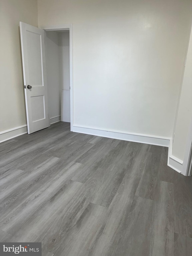 empty room featuring dark hardwood / wood-style flooring