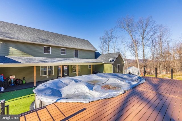 wooden terrace featuring a jacuzzi