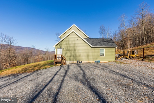 rear view of property with a mountain view