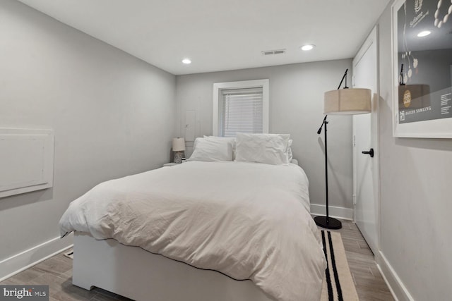 bedroom with hardwood / wood-style flooring