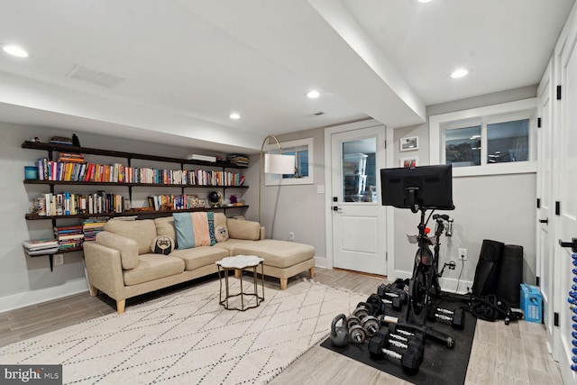 workout room with light wood-type flooring