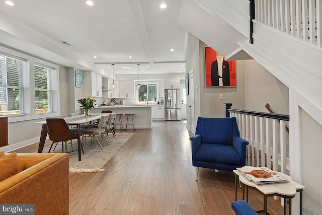 interior space featuring a healthy amount of sunlight and light hardwood / wood-style floors