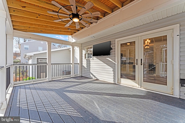 deck featuring ceiling fan and french doors