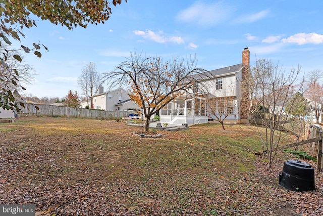 view of yard with a sunroom