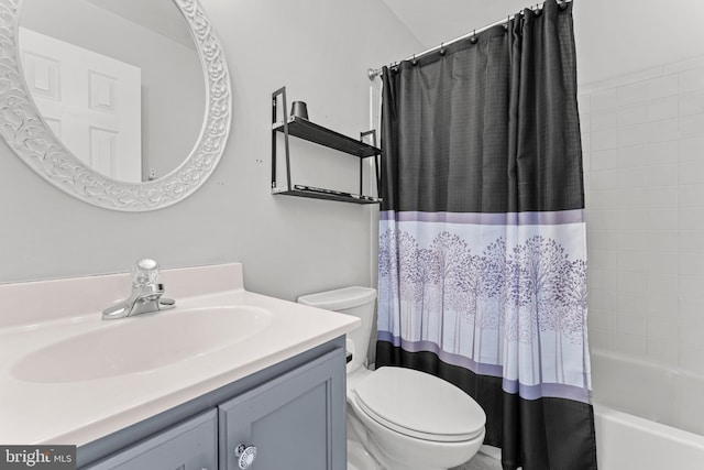 full bathroom featuring vanity, toilet, and shower / tub combo