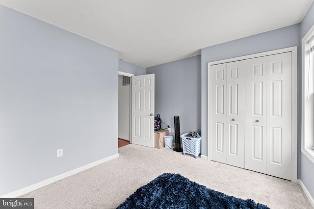 bedroom with carpet floors and a closet