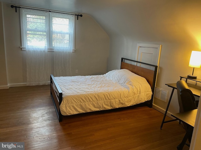 bedroom featuring dark hardwood / wood-style floors