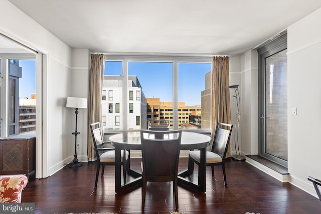 dining area with dark hardwood / wood-style flooring