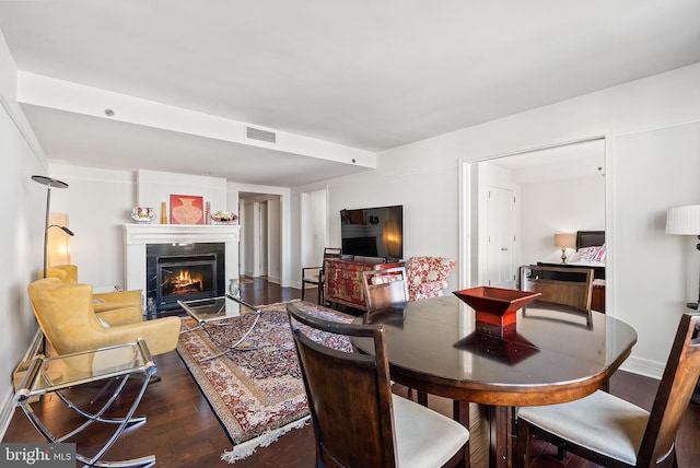 living room featuring dark wood-type flooring