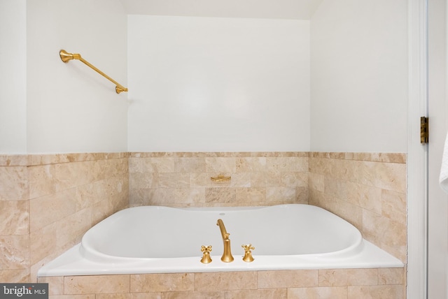 bathroom with tiled tub