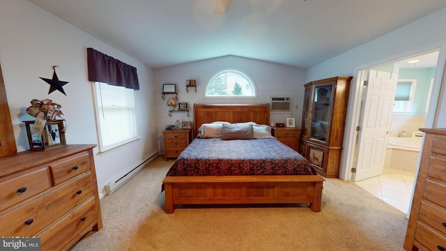 bedroom with light carpet, a baseboard heating unit, an AC wall unit, ensuite bath, and vaulted ceiling