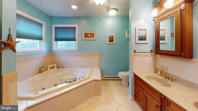 bathroom with vanity, a baseboard heating unit, tile patterned flooring, toilet, and tiled bath