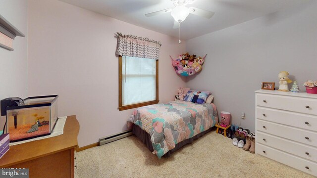 carpeted bedroom featuring a baseboard radiator and ceiling fan