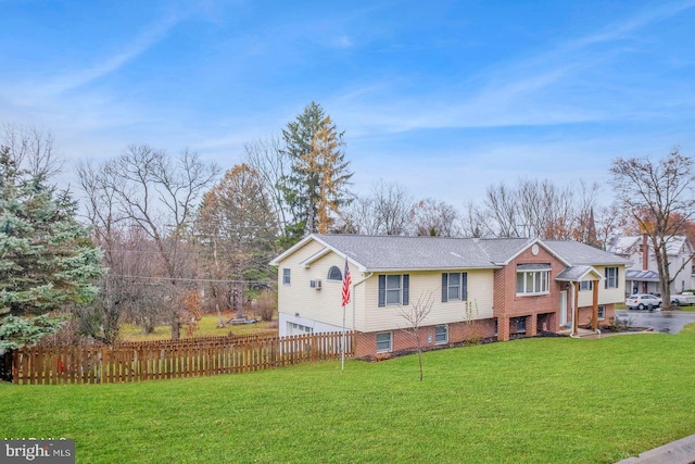 view of front of home with a front lawn and a garage