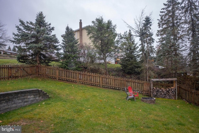 view of yard with a fire pit