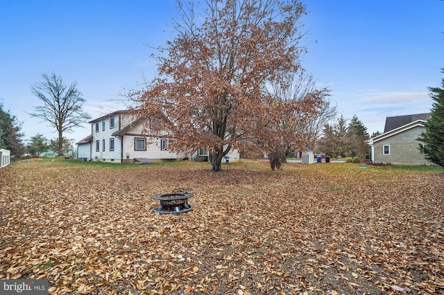 view of yard featuring a fire pit