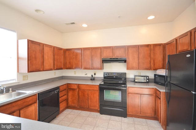 kitchen with sink and black appliances