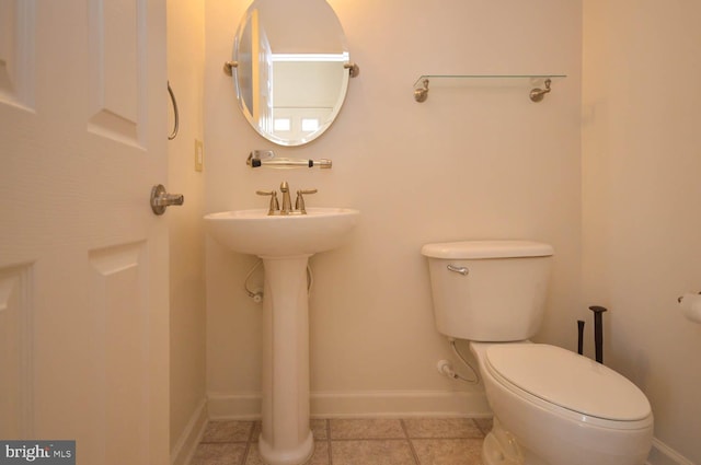 bathroom featuring tile patterned floors and toilet