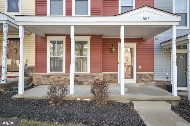 entrance to property featuring a porch