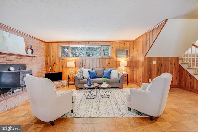 living room with wood walls and crown molding