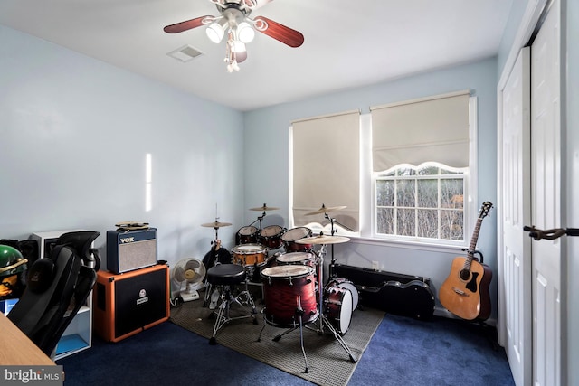 carpeted office with ceiling fan
