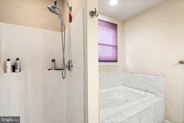 bathroom with tiled bath
