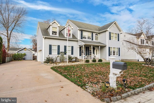 view of front facade featuring a porch and a garage