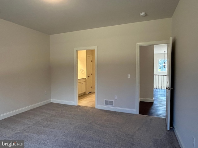 unfurnished room with light carpet