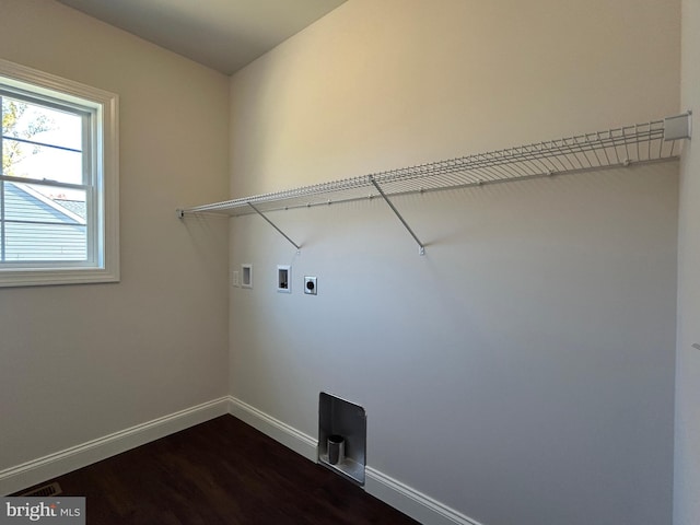 laundry area featuring dark hardwood / wood-style flooring, washer hookup, and hookup for an electric dryer